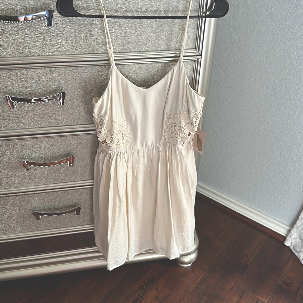 Brand new size small lace cutout panel detailing cream dress